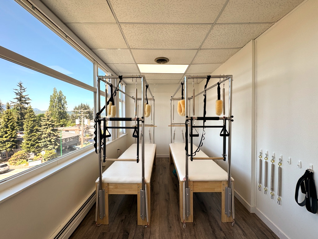 Pilates equipment by the studio window