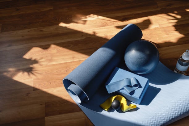 Pilates mat and props in warm light