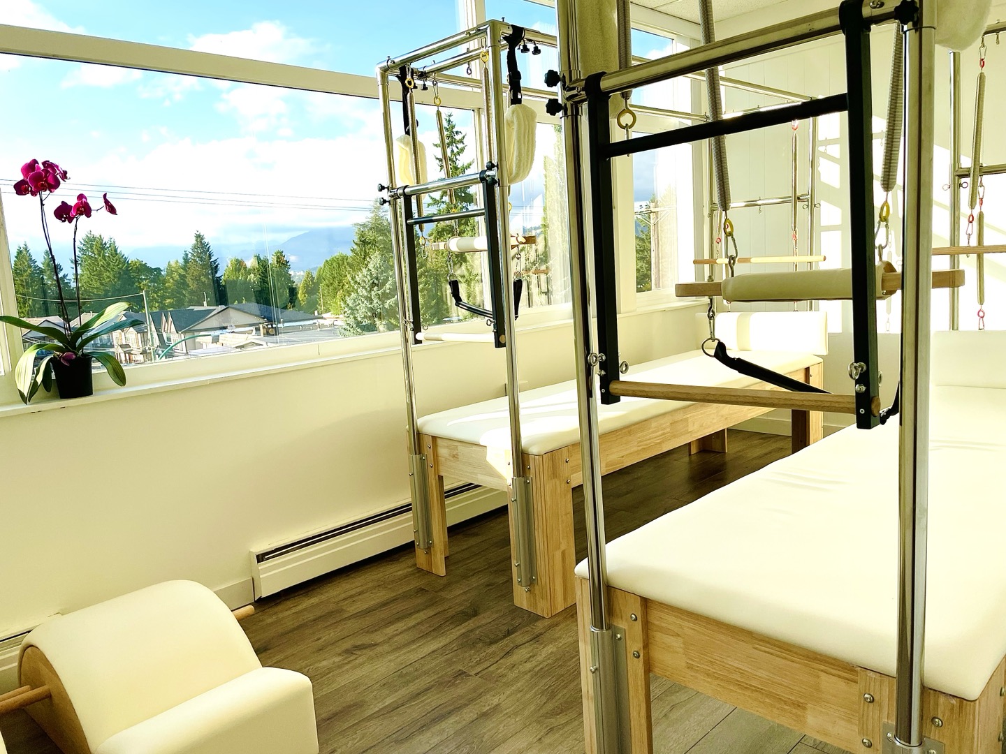 Pilates equipment beside studio windows