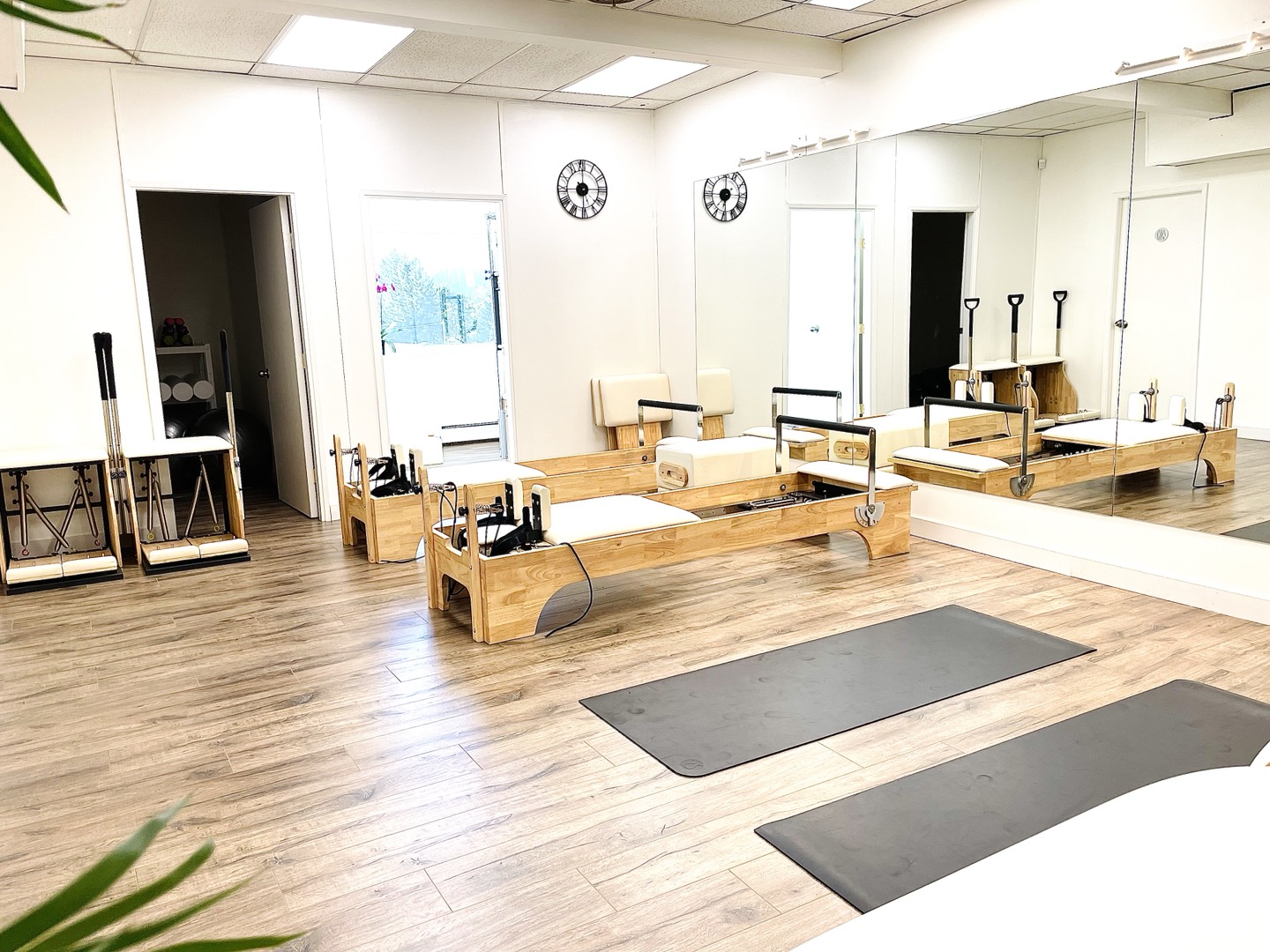 Clean Pilates studio with reformer equipment